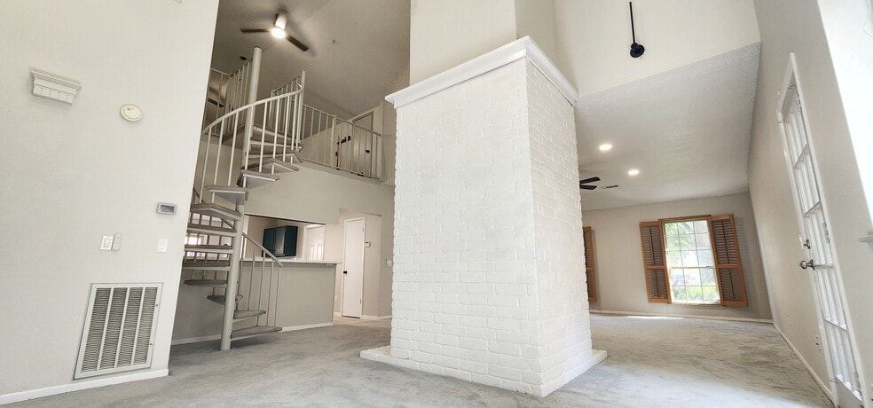 Second living space behind fireplace and door to the side of the house - 4722 Rainbow Run