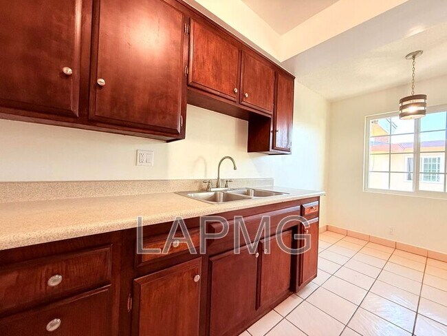 Building Photo - 7039-7039 Miles Ave