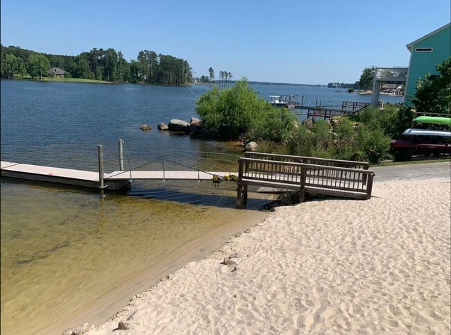 Building Photo - Partially Furnished Lakefront Retreat in Sunset Bay – Stunning Views & Resort-Style Amenities