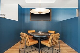 Entertain guests in the clubroom at Modera Newton. - Modera Newton