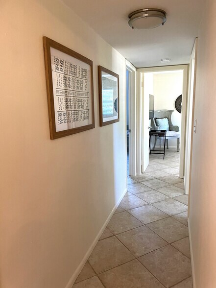 Hallway leads from the Living Room to the bedrooms & guest bathroom - 465 8th St N