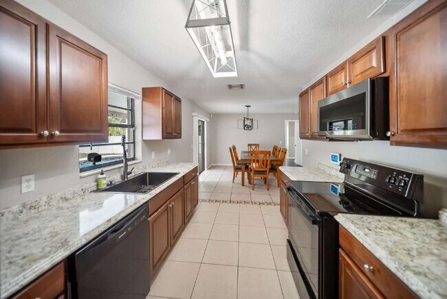 Building Photo - Heated Pool. Premium Upgrades. Fully Renov...