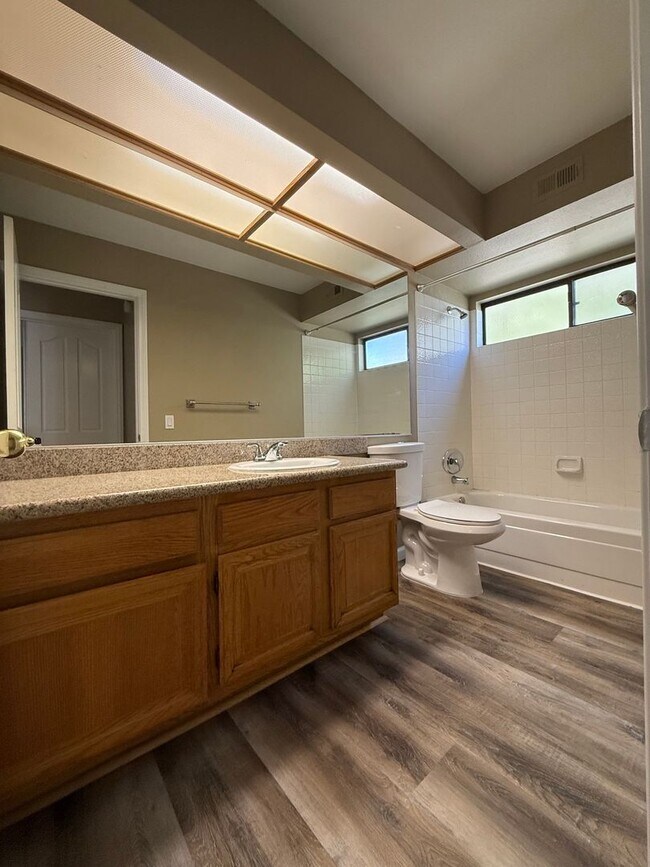Building Photo - TWO BEDROOM TOWNHOME IN THE LAKES WITH GARAGE AND ATTACHED CARPORT