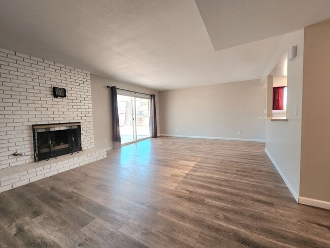 Building Photo - 4 Bedroom Two-Story Home with Downstairs Primary Bedroom & Fireplace
