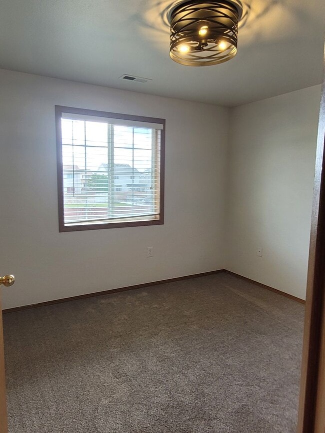 Building Photo - August Rent FREE - 4 Bedroom / Triple Car Garage