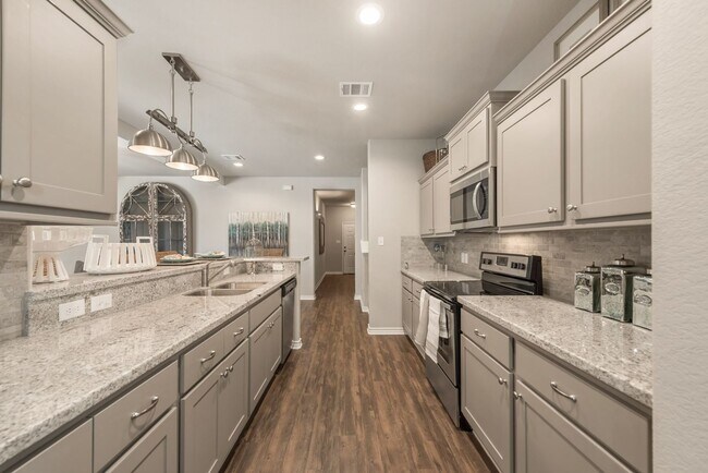Building Photo - Now Pre-Leasing for June 2026! Well Appointed Townhomes with Fenced Backyards Close to Bus Stop &...