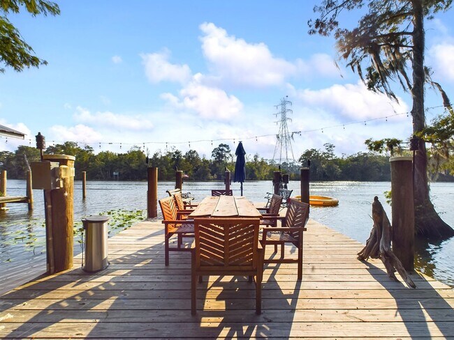 Building Photo - Private Furnished Riverfront Estate with Dock & Guest Apartment