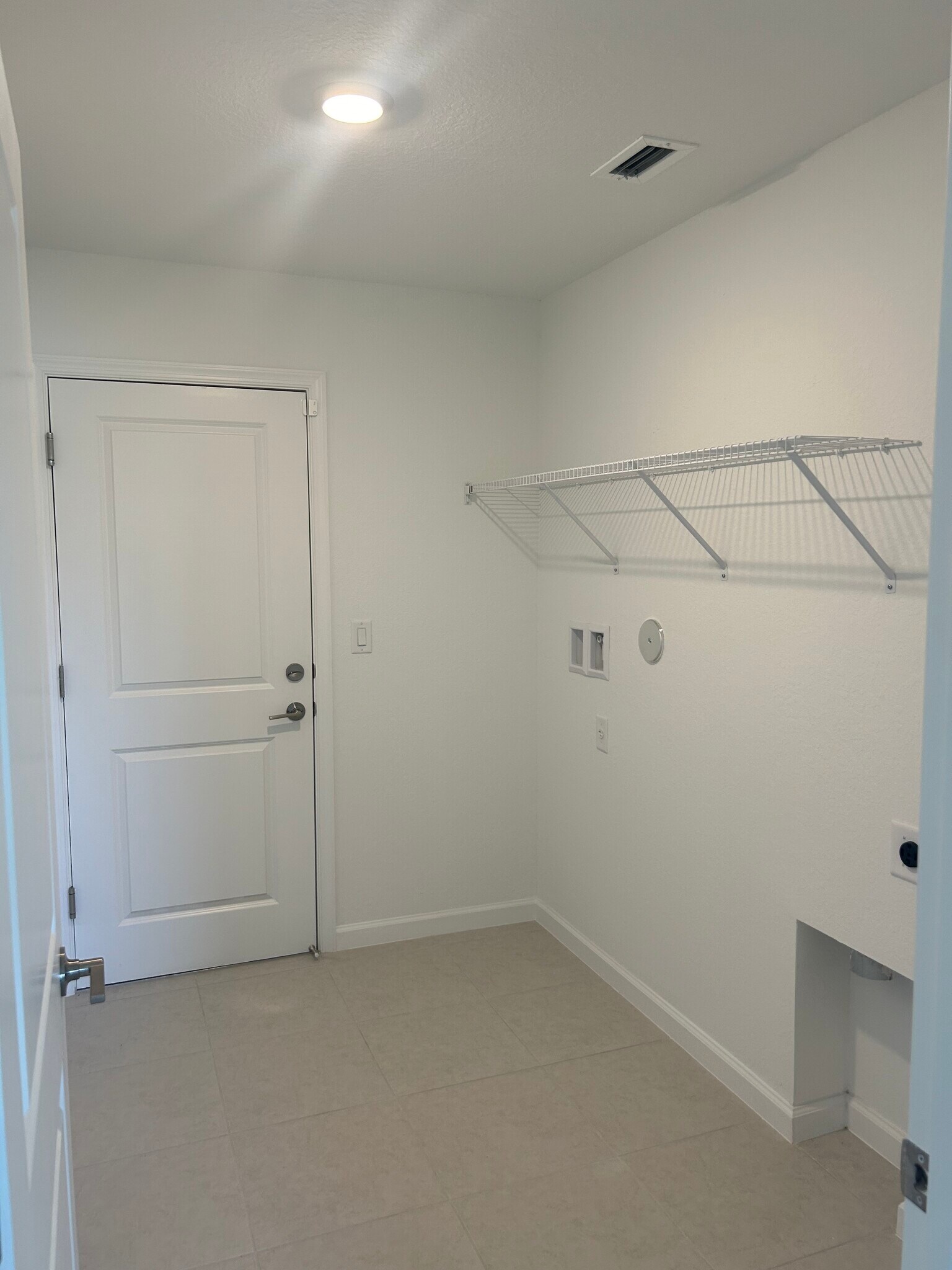 Laundry Room w/ Door to Garage - 4213 Longmour Ln