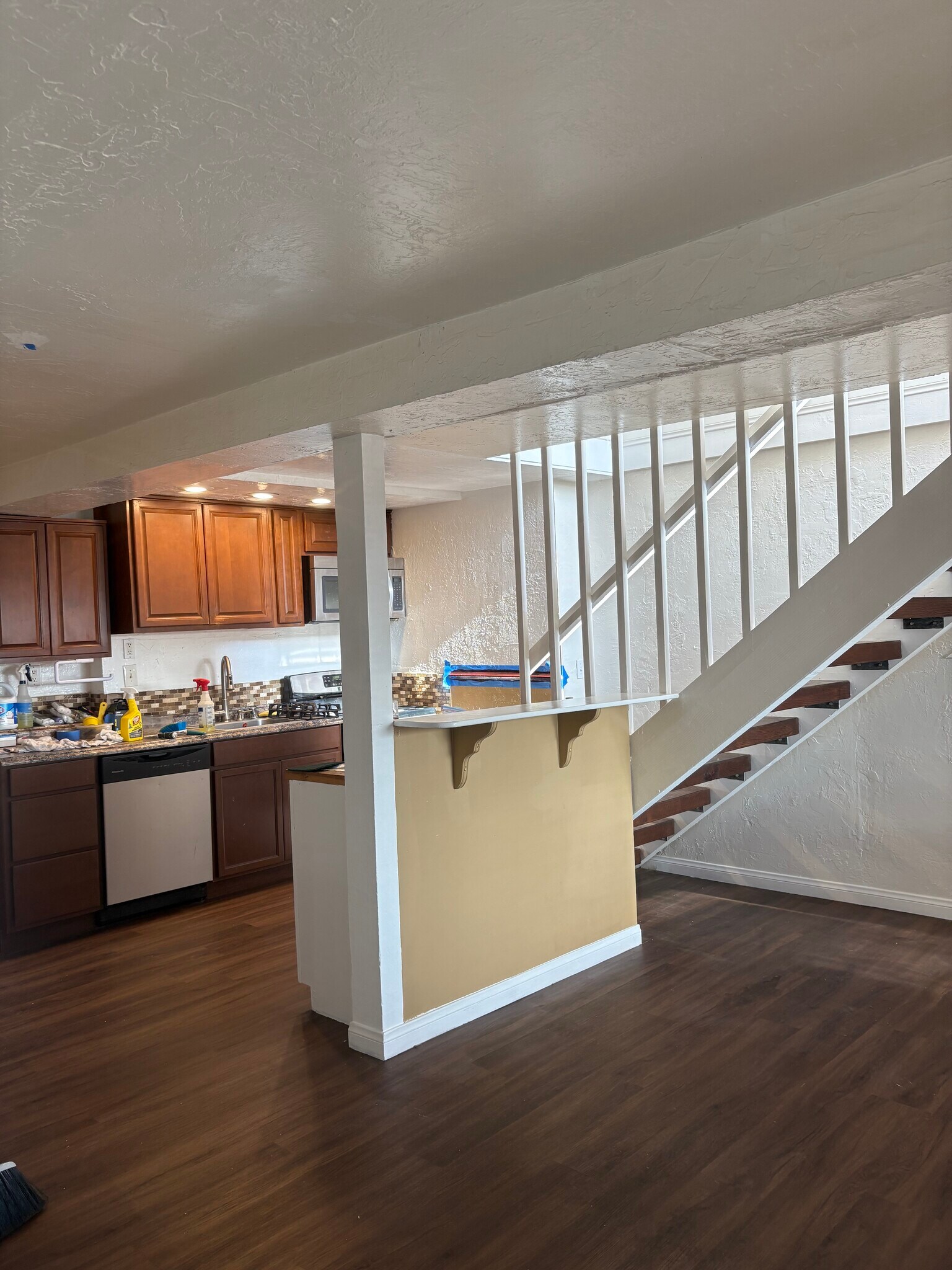 Breakfast bar kitchen and stairs to upstairs primary , office and view deck - 2424 Jefferson St