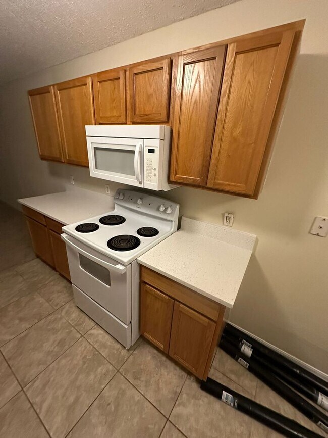 Building Photo - New Paint, Floors and Solid Surface Counte...