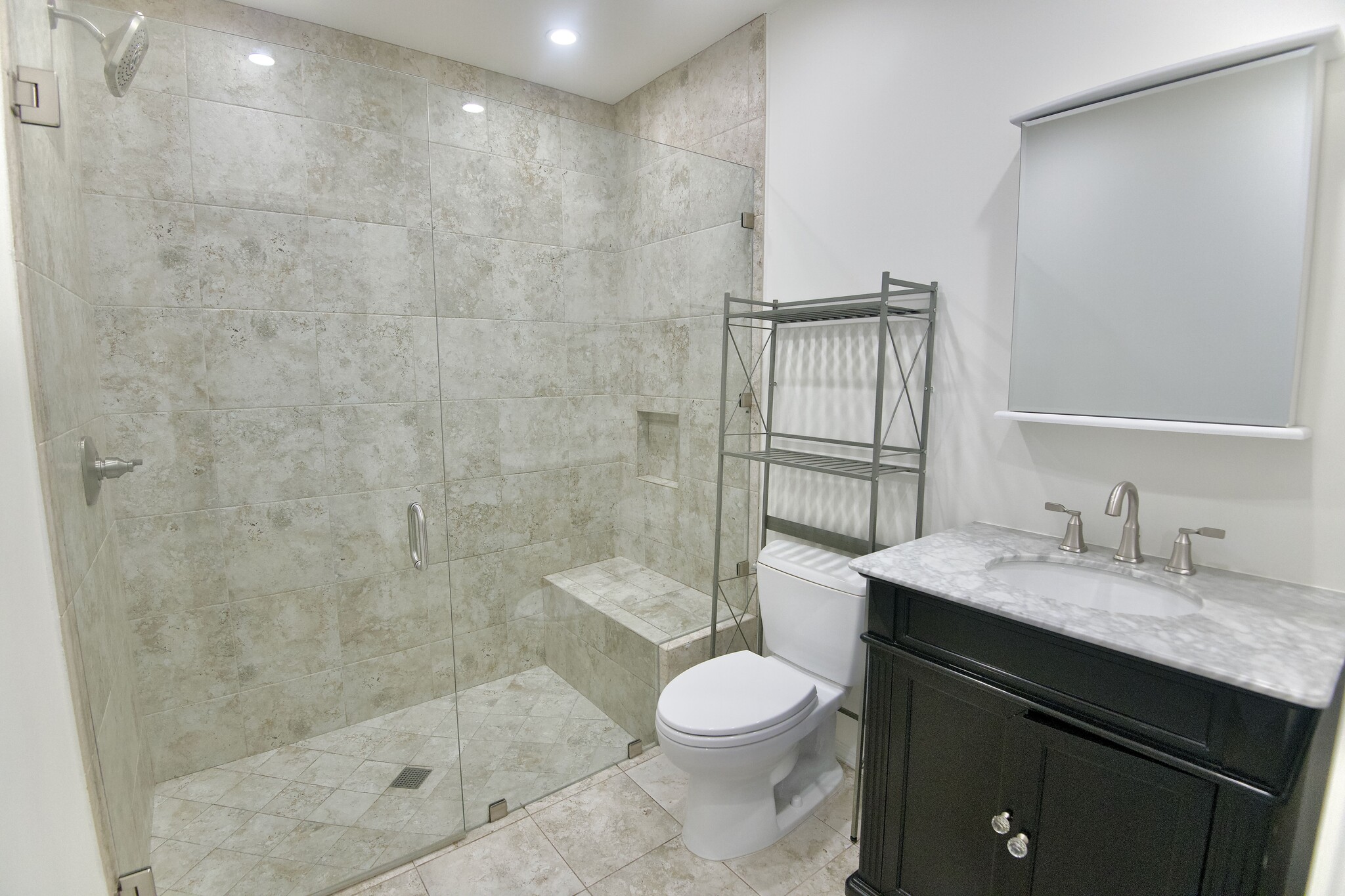 Primary Bath with Shower Bench and Storage - 4755 Wiota St