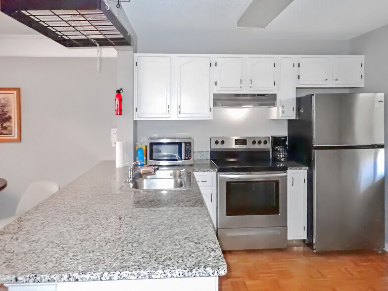 Upgraded kitchen, new granite countertop, stainless steel appliances. - 3601 Saint Johns Ct