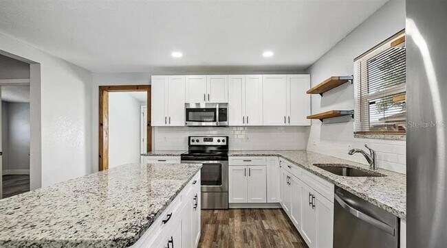 Building Photo - 1411 E 24th Ave