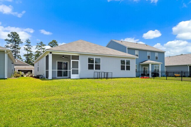 Building Photo - Modern 4BR Home with Screened Porch & Pond Views | Sun Colony, Longs SC