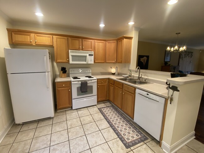 Kitchen with full appliances, including blender, coffee pot, and toaster. - 600 Mitchell Bridge Rd