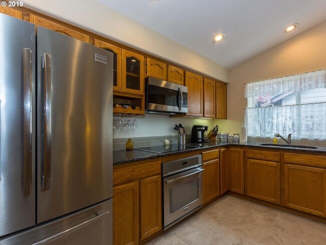 Building Photo - Charming 4-Bed, 2-Bath Home with Vaulted Ceilings, Dual Fireplaces & Serene Outdoor Spaces