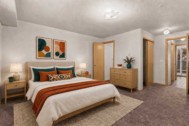 Staged bedroom with bold, contemporary style. - Villas at Lawrence