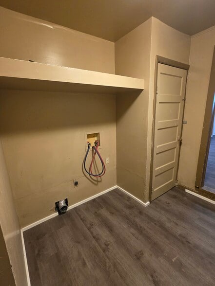 Laundry room with Basement Door - 552 5th Ave W