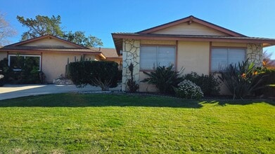 Building Photo - Spacious 4-Bedroom 2 Bath Home with a Large, Serene Backyard and Courtyard.