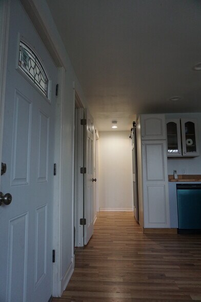 Hall from kitchen to bedroom, bathroom - 4185 Monroe Ave NE