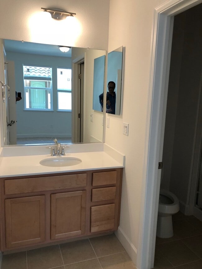 Building Photo - Tri-level Townhome with 2 Car Attached Gar...