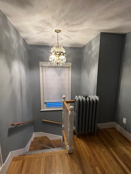 Foyer with original antique chandelier - 111 Falcon St