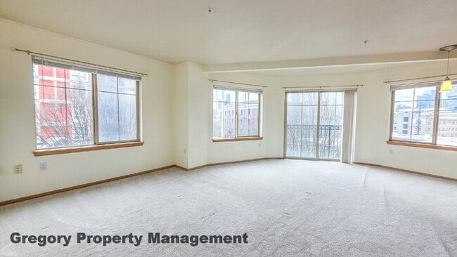 Building Photo - Sunny Capitol Hill 2 BR 1.5 BA Condo with Garage Parking Included & Skyline Views!