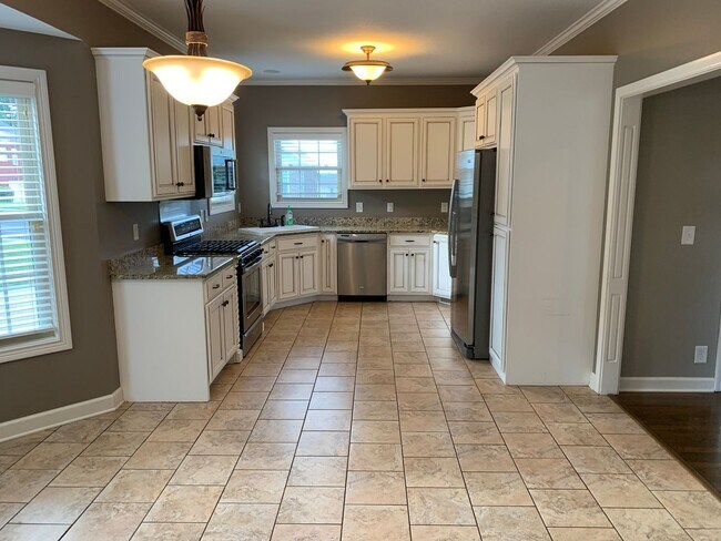 Building Photo - Luxury Living! Beautiful Brick Home in Sango with 3 car garage.