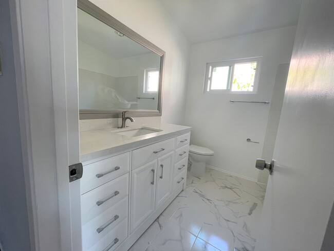 Second bathroom w/ new vanity - 419 Longfellow Ave