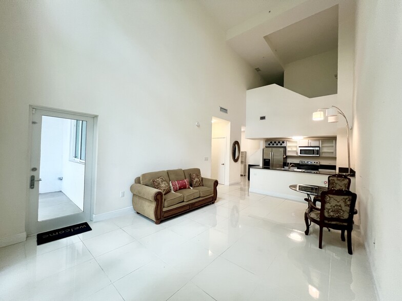 Living Area with Door to Outside Patio - 1871 NW South River Dr