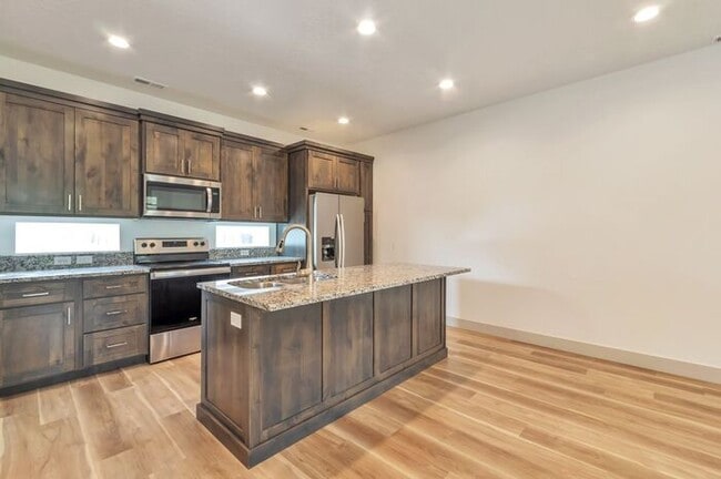 Building Photo - Modern End Unit townhouse w attached 2 car...