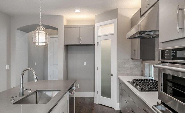 Building Photo - Bethany Stunner - 5 Bedrooms with Main-Level Bed & Bath, Modern Kitchen & Private Fenced Yard