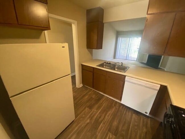 Building Photo - NOW AVAILABLE! Charming 2-Bedroom, 2-Bathroom Single-Level Townhome