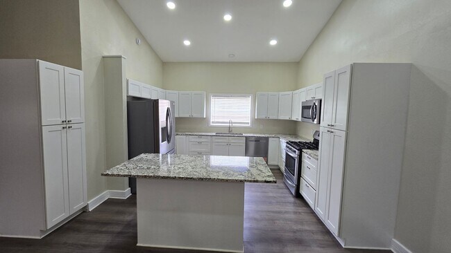 Building Photo - Spacious Ranch Style 5-Bedroom Home with Oversized 4 Car Garage / Workshop, 4 RV Carport & 1 Acre...