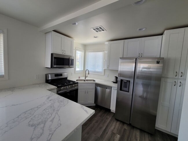 Building Photo - Spacious Home in Linda Vista with Modern A...