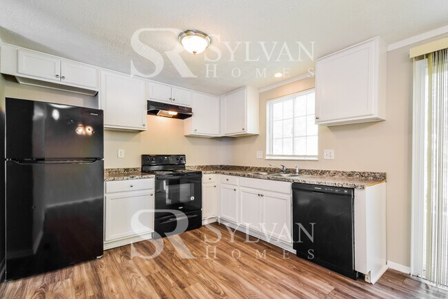 Building Photo - The living is easy in this 4 bedroom, 2 ba...