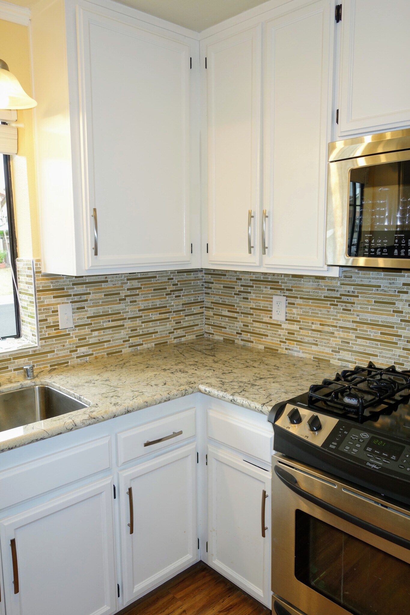 Updated kitchen counters and backsplash - 983 Hacienda Circle