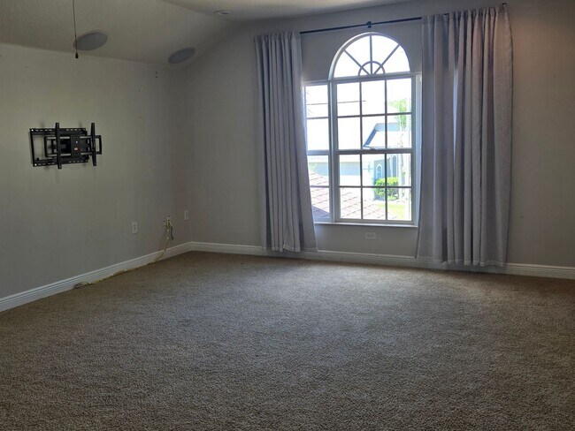 Building Photo - Freshly Painted 4BR/2BA Pool Home with Screened Pool & Spa – Move-In Ready!