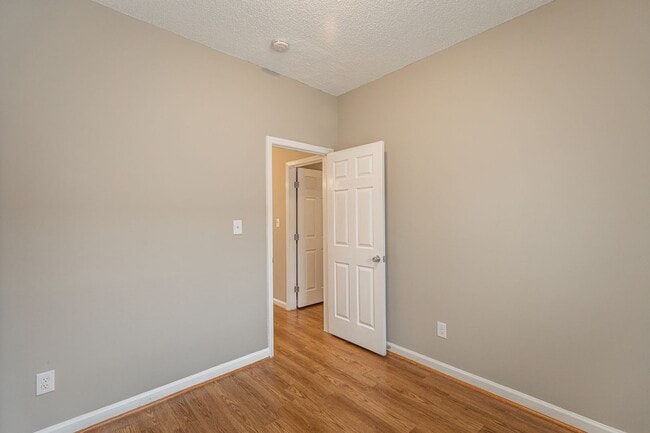 Building Photo - Like New Home off Freeman Mill.  Just Painted, New Wood/Vinyl Flooring, Vaulted Ceilings, Front P...