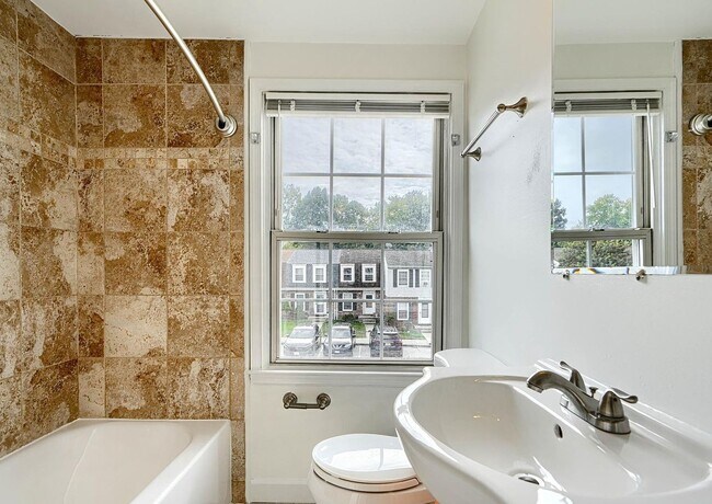 Building Photo - Updated End-of-Group Townhome with Finished Lower Level, Fenced Yard & Community Pool