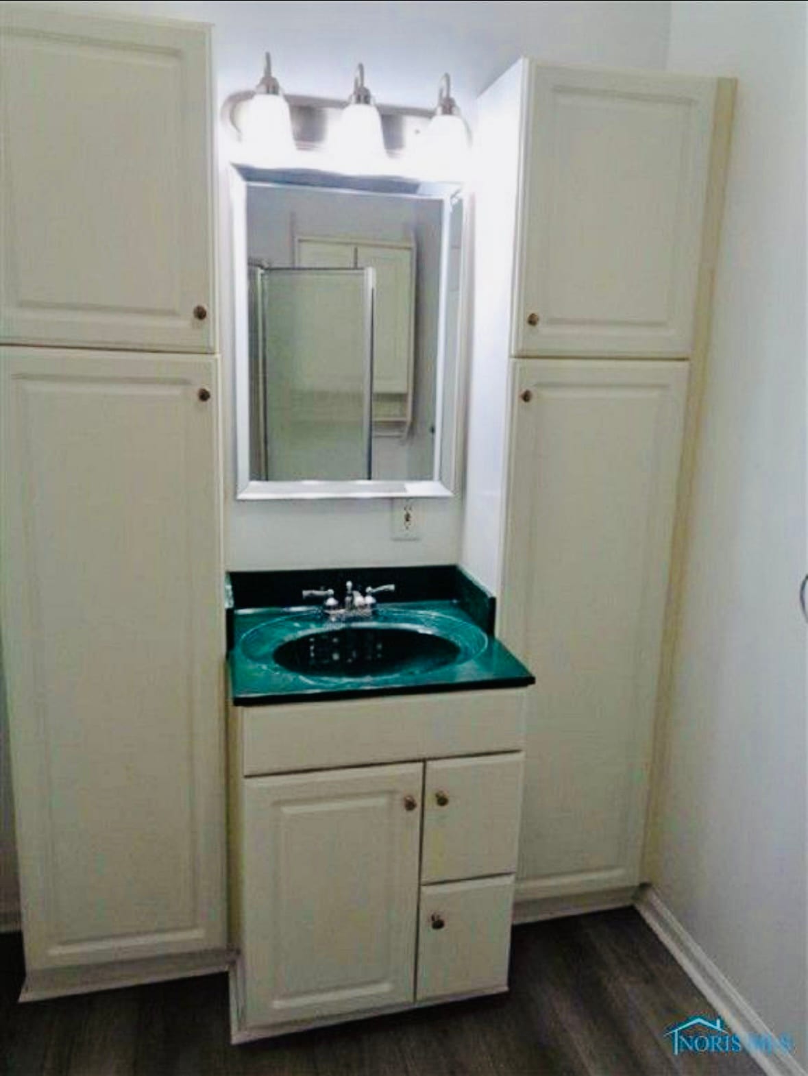 Full bathroom sink and large cabinets. - 319 Garfield Ave