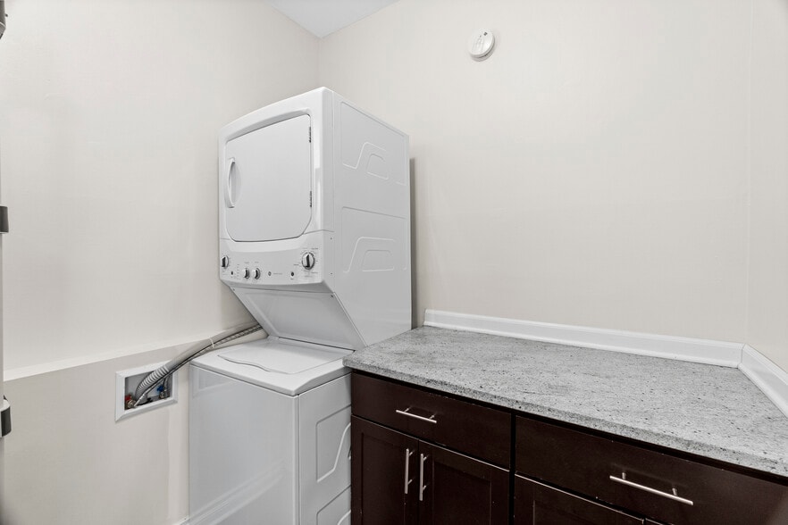 Large laundry with storage and folding station. - 2338 W 18th Pl