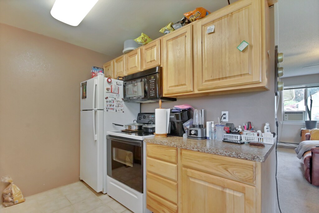 Self cleaning glass top stove and built in microwave. Lots of drawers. - 7017 Sacramento St SW