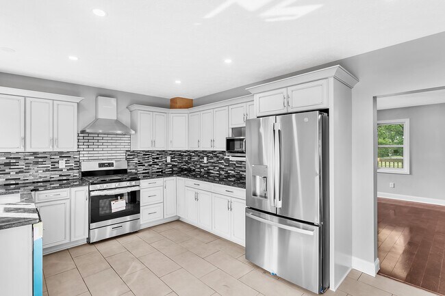 Beautiful crown molding provides a sophisticated finished look on the solid wood, soft close cabinet - 2416 Magee Road Ext