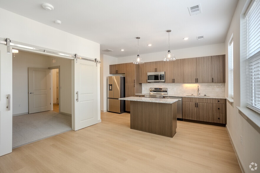 1BR, 1BA - 566 SF - Primrose Kitchen/Livingroom - Meridian at Wylie - 55+ Affordable Apartments