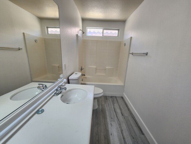 Building Photo - Sleek 2 story home with tile in most living areas and upgraded kitchen.