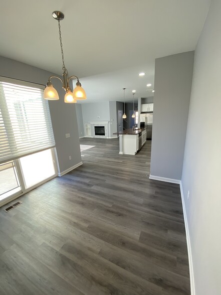 Dining area and view from garage rear door entry - 16155 W 62nd Ln