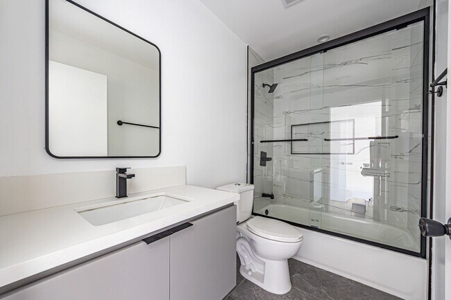 Building Photo - Designer-inspired, tri-level townhome offe...