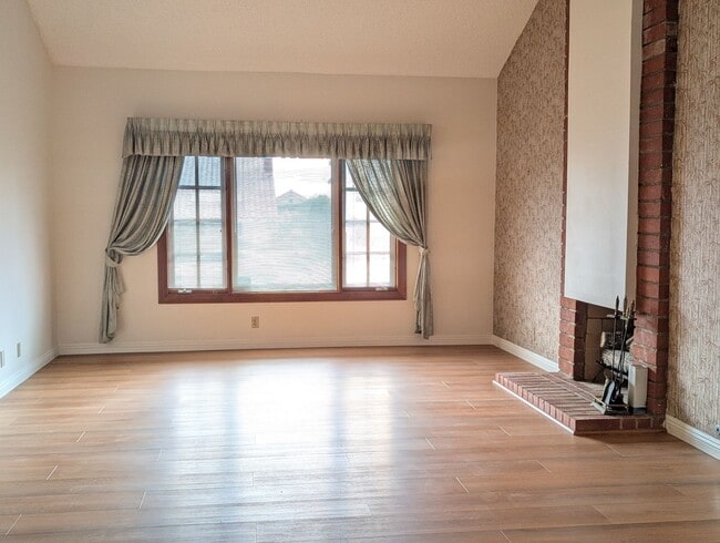 Building Photo - Rare opportunity to lease a 4-bedroom home featuring oversized bedrooms, scenic hilltop city view...