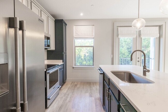 Building Photo - RARE 3 BEDROOM 2 BATH CONDO AT THE INLET -...